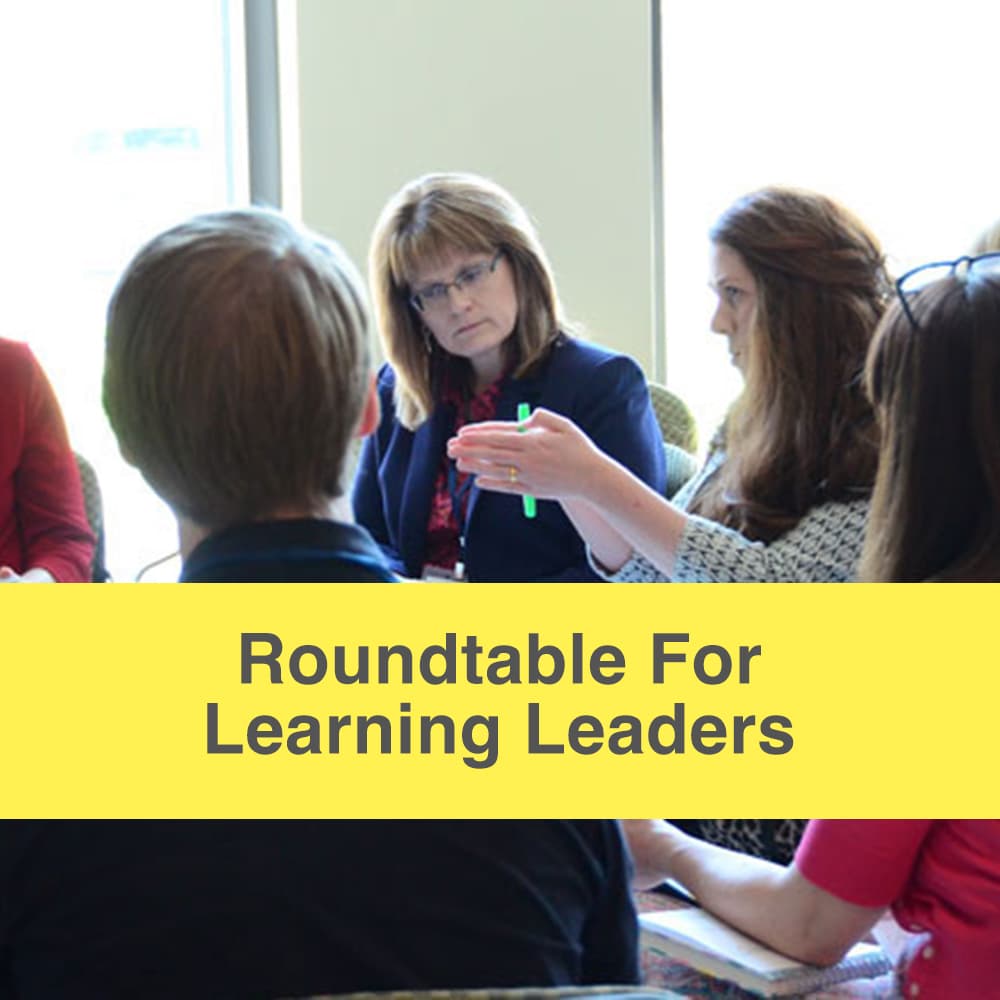 Roundtable for learning leaders caption, image of community members huddled in a circle having a discussion