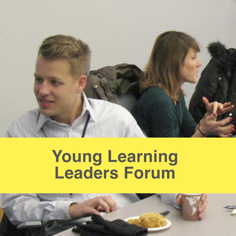Young learning leaders forum caption, image of two community members having conversations